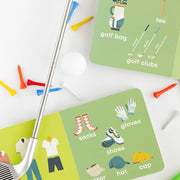Golf Baby board book open to the golf attire and golf bag pages with a golf club