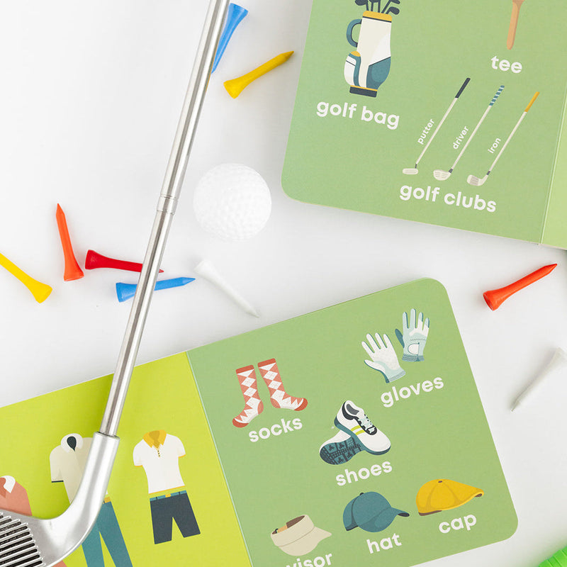 Golf Baby board book open to the golf attire and golf bag pages with a golf club
