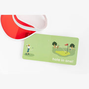 Golf Baby board book open to the hole in one page with a red visor