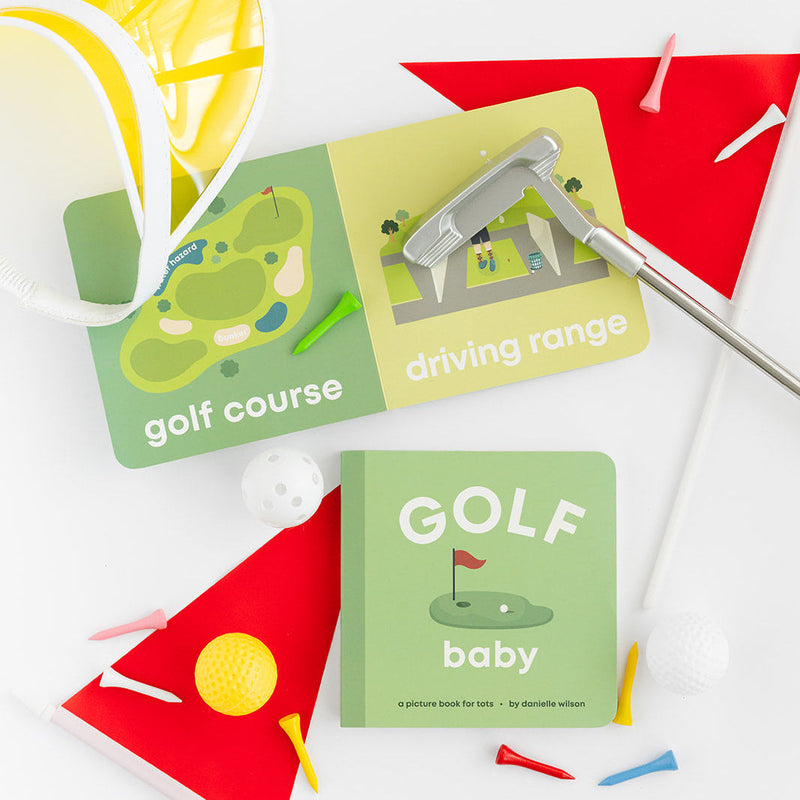 Golf Baby board book open to the golf course page with a flag