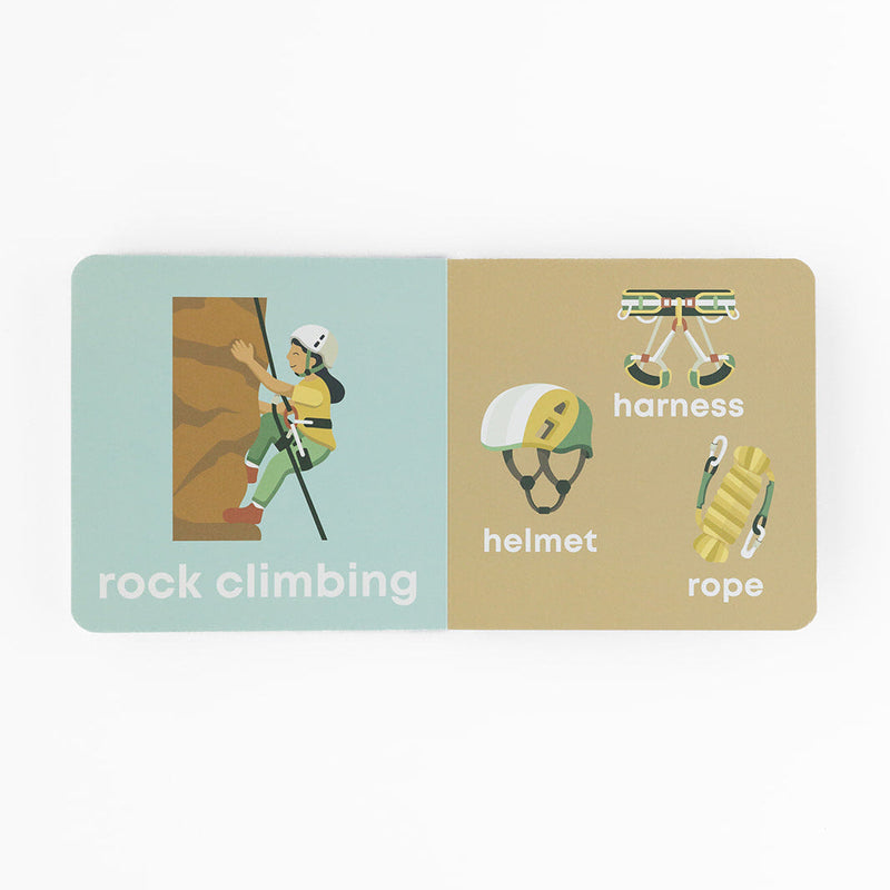 Mountain Baby board book open to the rock climbing and helmet pages