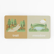 Mountain Baby board book open to the trail and meadow pages