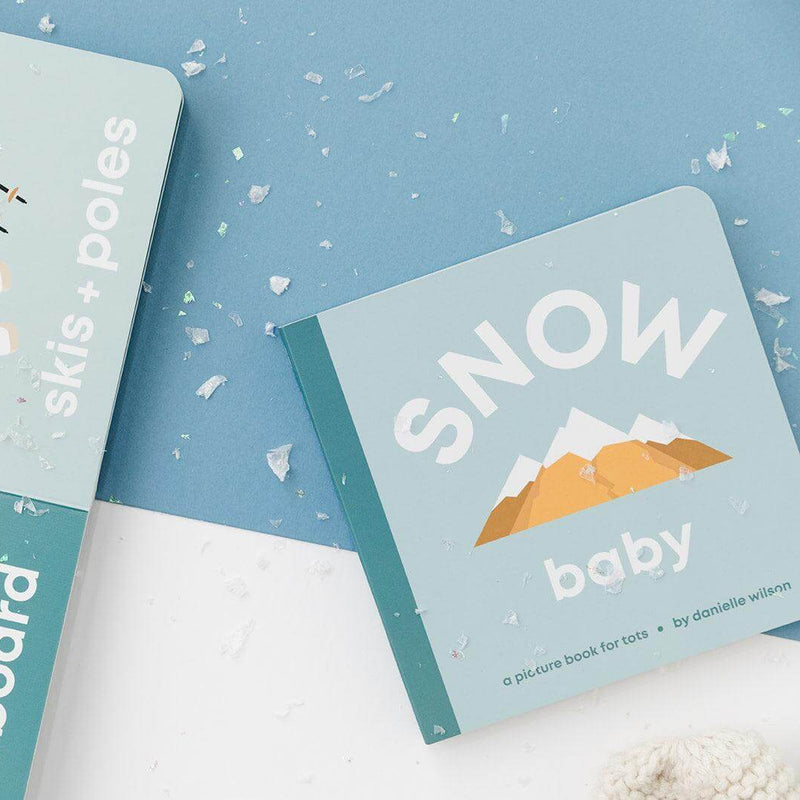 Snow Baby board book with the skis and snowboard pages