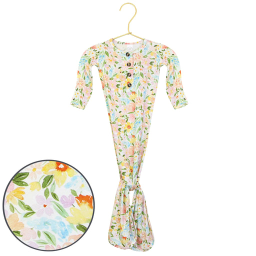 Floral-patterned baby outfit on a hanger with a close-up of the pattern.