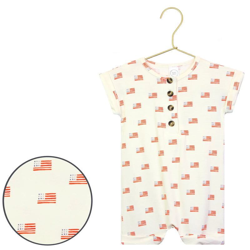 Baby romper with flag pattern on a hanger against a white background
