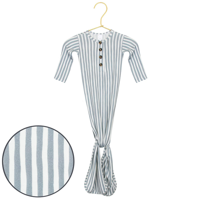 Striped gown on a hanger with close-up of fabric texture.