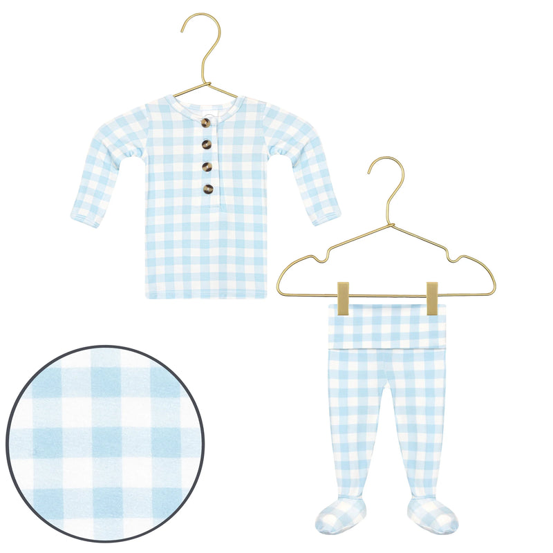 Blue and white checkered baby outfit with buttons on a hanger against a white background.