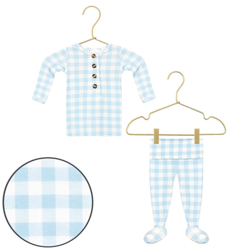 Blue and white checkered baby outfit with buttons on a hanger against a white background.