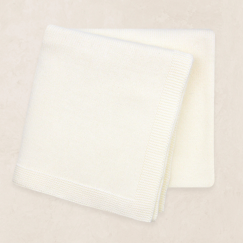 ivory knit baby blanket folded