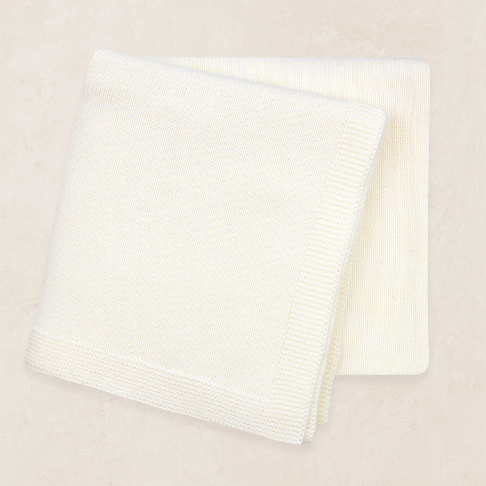 ivory knit baby blanket folded