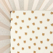 Lou Lou & Co Teddy print crib sheet with beige bear faces on cream background and snug elastic edges