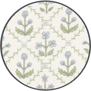 Close-up of Lou Lou & Co Etta fabric showing delicate blue flowers and green leaves in a repeating vine pattern on a creamy white background