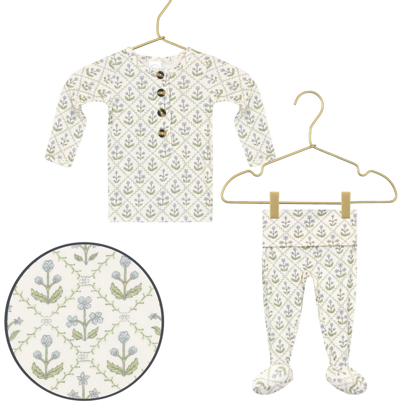 Lou Lou & Co Etta newborn top and bottom set in cream with blue and green floral print displayed on hangers