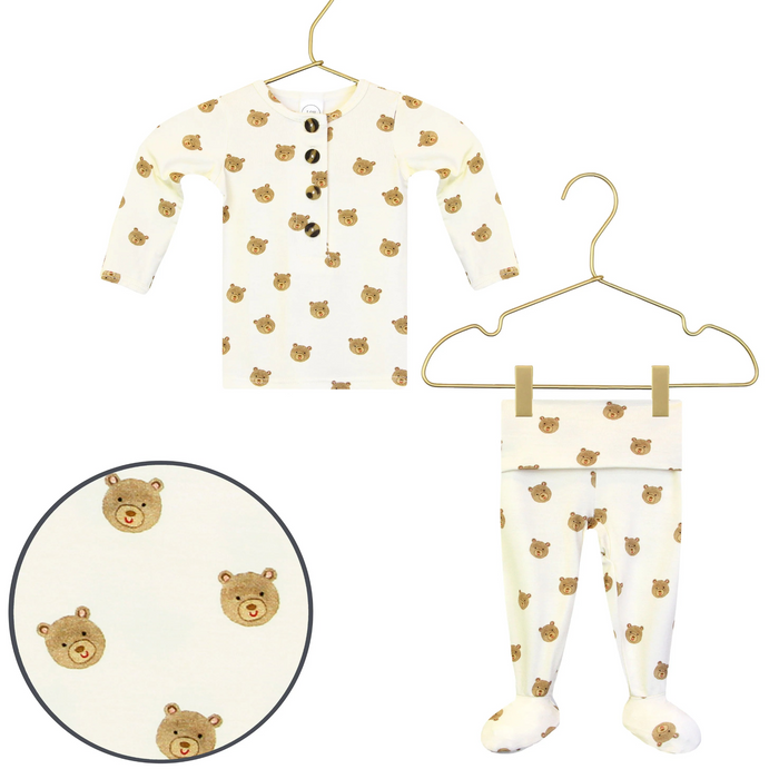 Lou Lou & Co Teddy newborn top and bottom set in cream with tan bear print displayed on hangers
