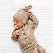 Newborn baby wearing Lou Lou & Co Wyatt print top and bottom set with matching knotted hat in neutral tan western pattern