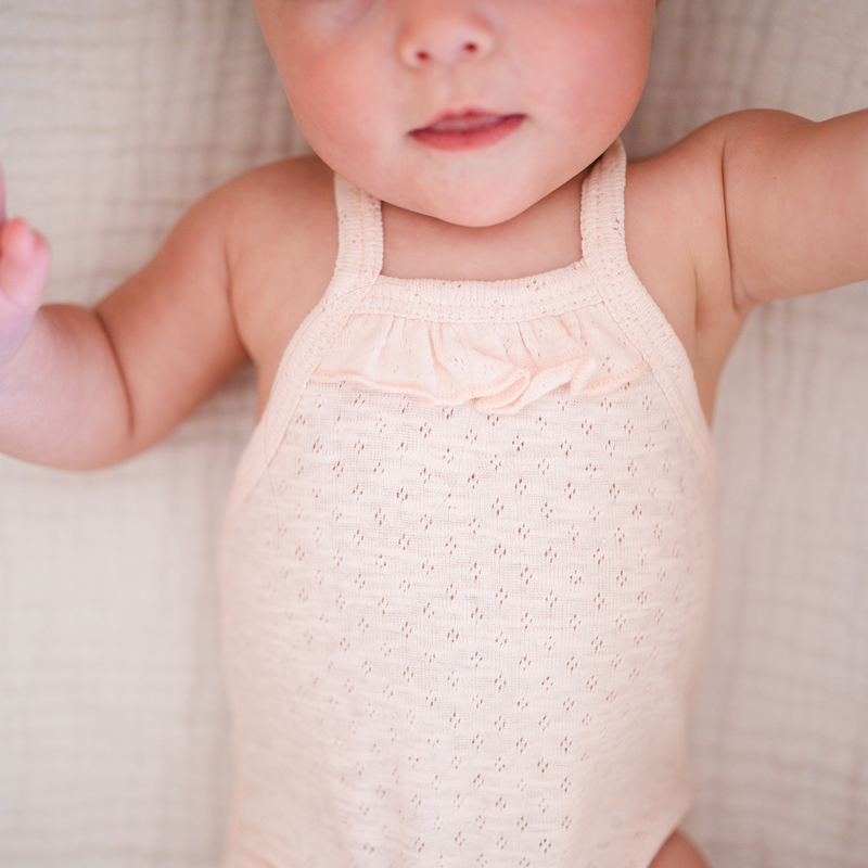 L'ovedbaby | Organic Pointelle Ruffle Criss-Cross Bodysuit | Cotton Candy