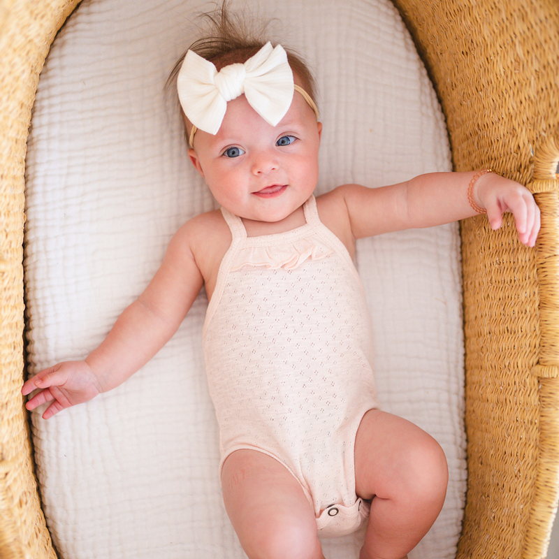 L'ovedbaby | Organic Pointelle Ruffle Criss-Cross Bodysuit | Cotton Candy