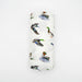 Flatlay of Saltwater Swaddles Lucky Ducks bamboo and cotton swaddle blanket showing multiple colorful duck illustrations