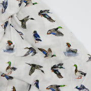 Close-up of Saltwater Swaddles Lucky Ducks fabric with detailed hand-painted ducks, including Mallards, Teals, and Pintails