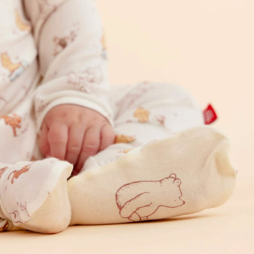 Close-up of baby footie showing soft fabric and foot detail