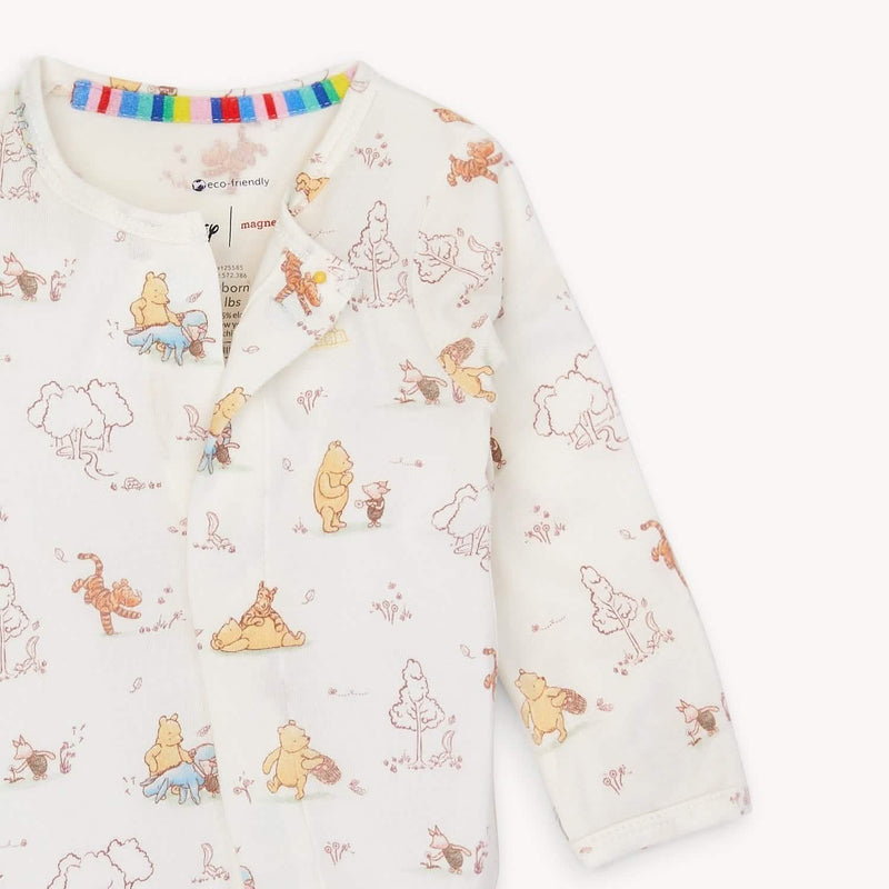 Front view of magnetic baby footie with long sleeves and snap-free design