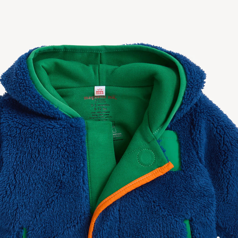 Close-up of Magnetic Me sherpa jacket showing hood, organic cotton lining, and magnetic placket