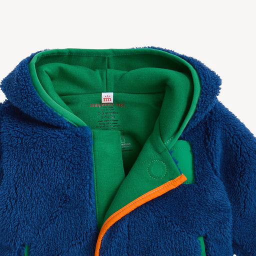 Close-up of Magnetic Me sherpa jacket showing hood, organic cotton lining, and magnetic placket