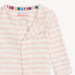Neckline and magnetic placket detail of Magnetic Me pink stripe footie