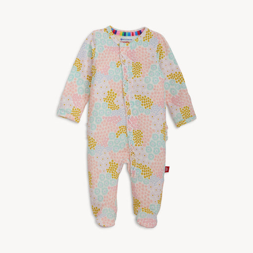 Floral patterned baby onesie on a white background