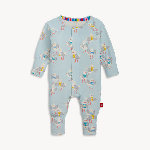 Baby onesie with bird pattern on a light blue background