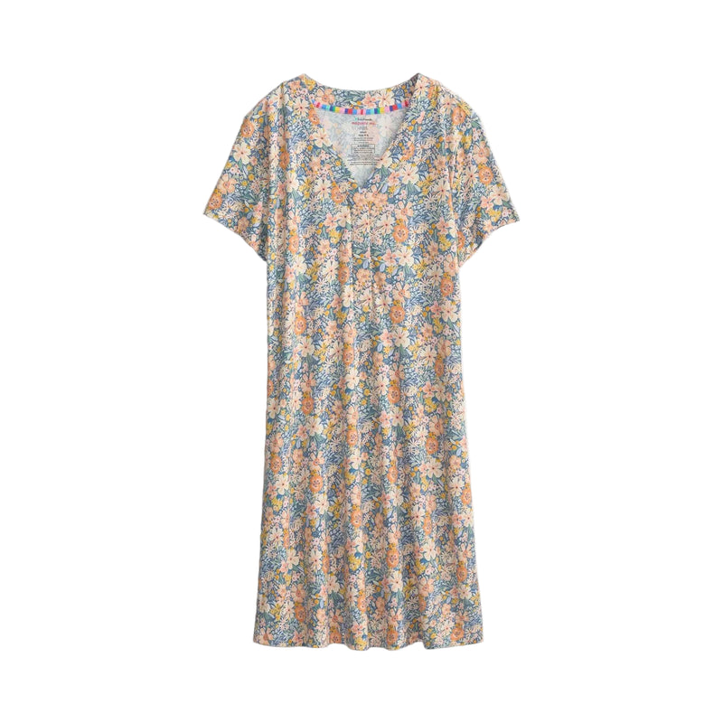 A short-sleeve V-neck dress with an all-over dense floral print in muted blue, beige, orange, and yellow tones, shown flat against a light off-white background.