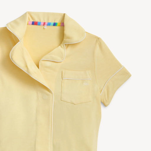 Yellow short-sleeve shirt with a collar on a white background