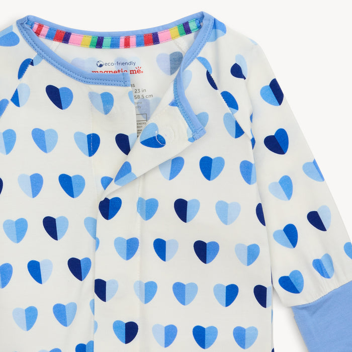 Close-up of Magnetic Me Convertible Coverall neckline showing blue trim, magnetic closure, and multicolor striped inner collar