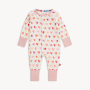 Full view of Magnetic Me Convertible Coverall in Pink XOXO print with pink cuffs and allover heart pattern