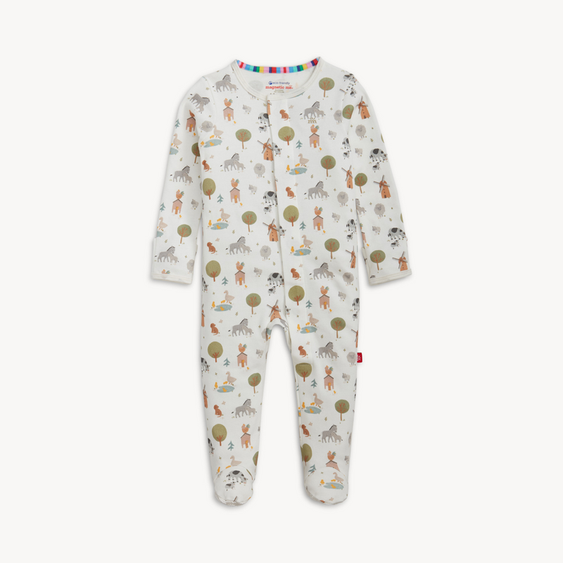 Baby onesie with farm animal pattern on a white background