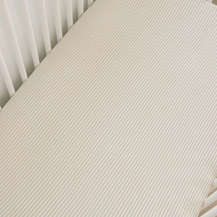 taupe stripe ribbed bamboo crib sheet in crib aerial angle