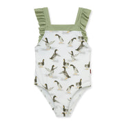 Children's swimsuit with mallard duck pattern and green ruffle straps on a white background
