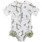 Baby girl sort sleeve rashgaurd style swimsuit with duck pattern and green ruffles on a white background