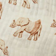 Pattern of brown elephants wearing tutus on a beige fabric background
