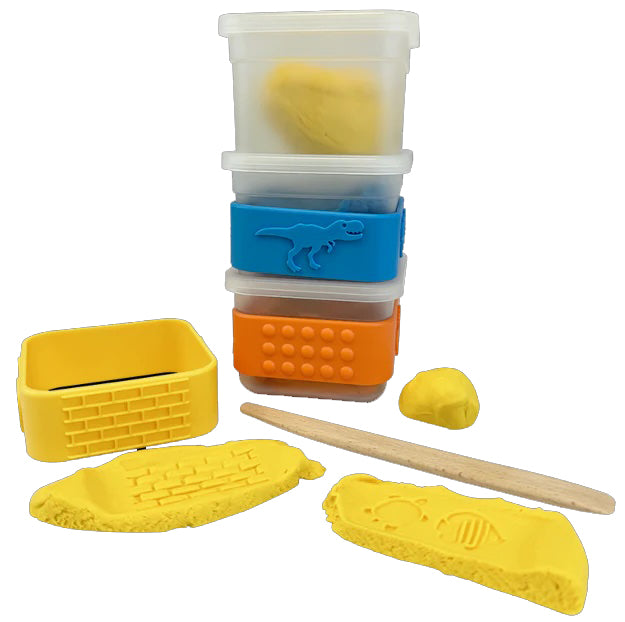 Set of yellow play dough tools with containers on a white background