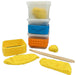 Set of yellow play dough tools with containers on a white background