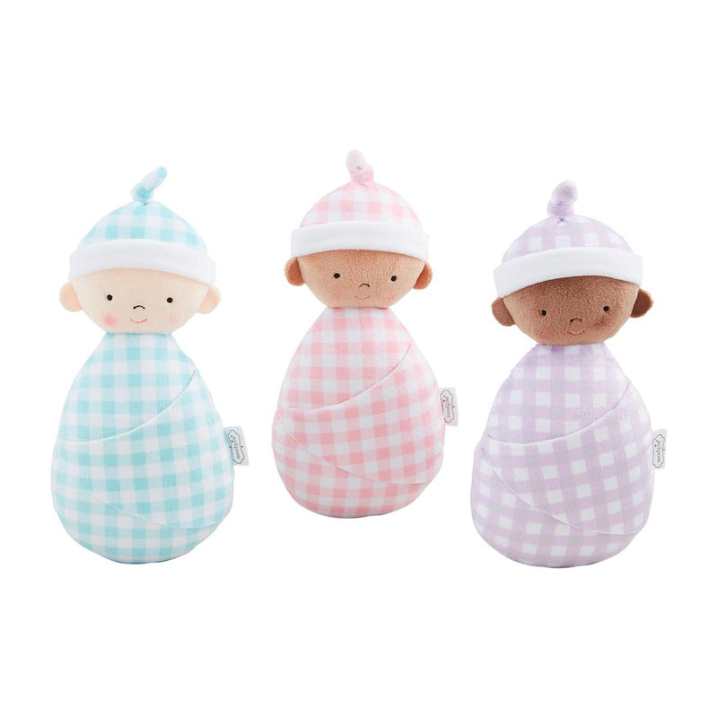Three baby dolls wrapped in gingham blankets with hats on a white background