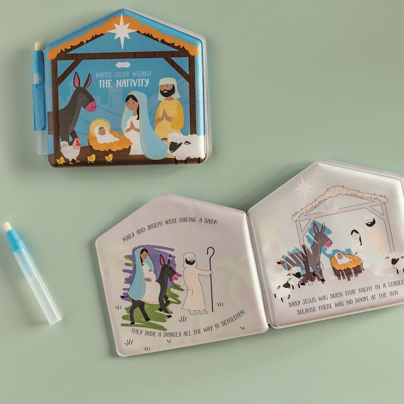 Mud Pie Water Wizard Nativity coloring book open to Christmas story pages, with water pen