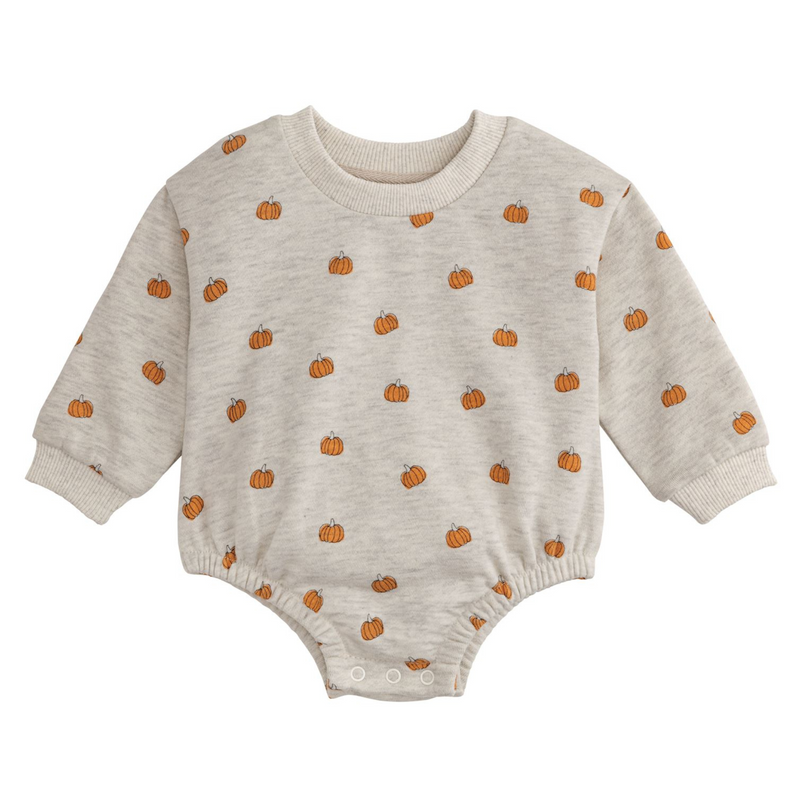 Beige baby onesie with orange pumpkin pattern on a white background
