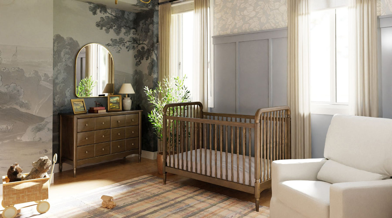 Nursery room with wooden crib, dresser, and decorative elements.