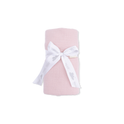 Pink blanket with a white bow on a white background