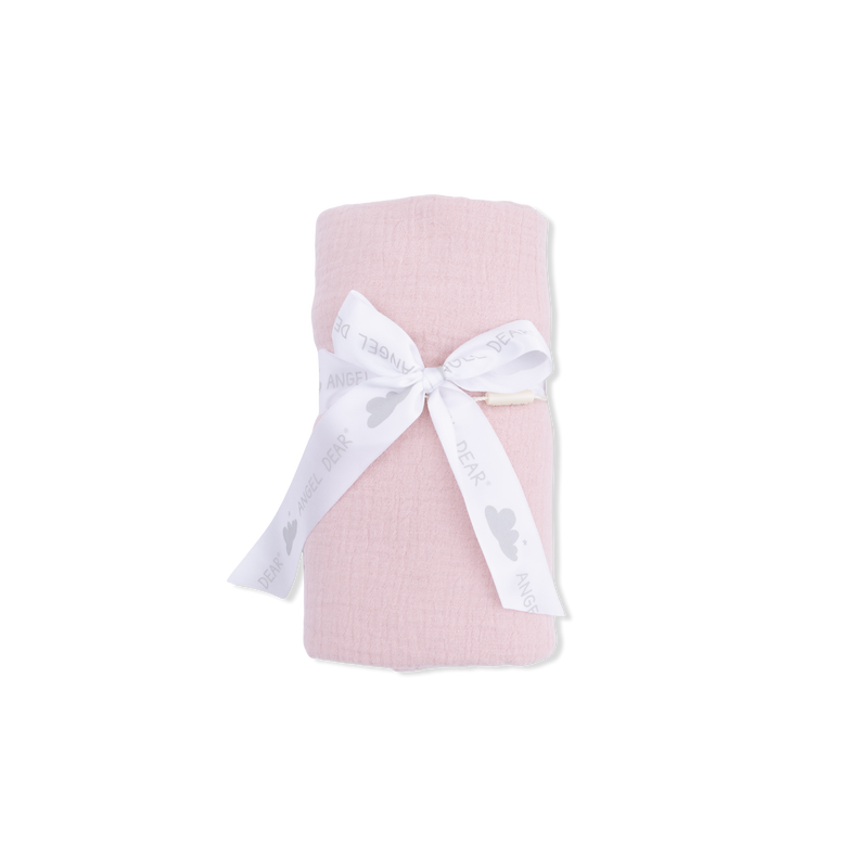Pink blanket with a white bow on a white background