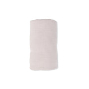 tan swaddle balnket on a white background