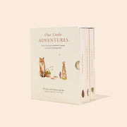 Book titled 'Our Little Adventures' with illustrations of a fox and rabbit on a beige background