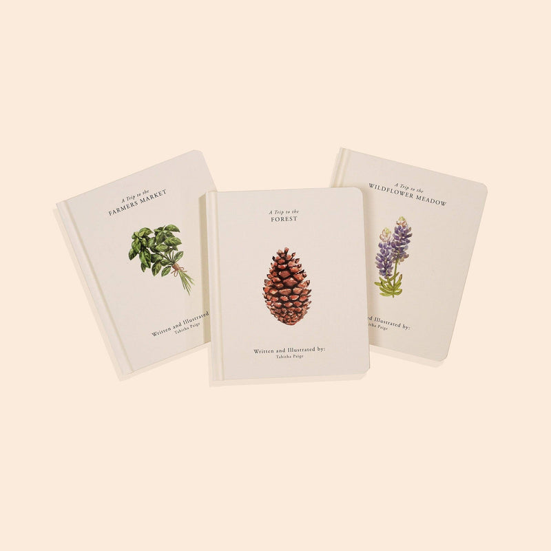 Three books with nature-themed illustrations on a beige background